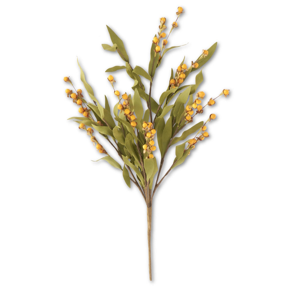 Artificial green leafy branch with small, round yellow berries on a white background.
