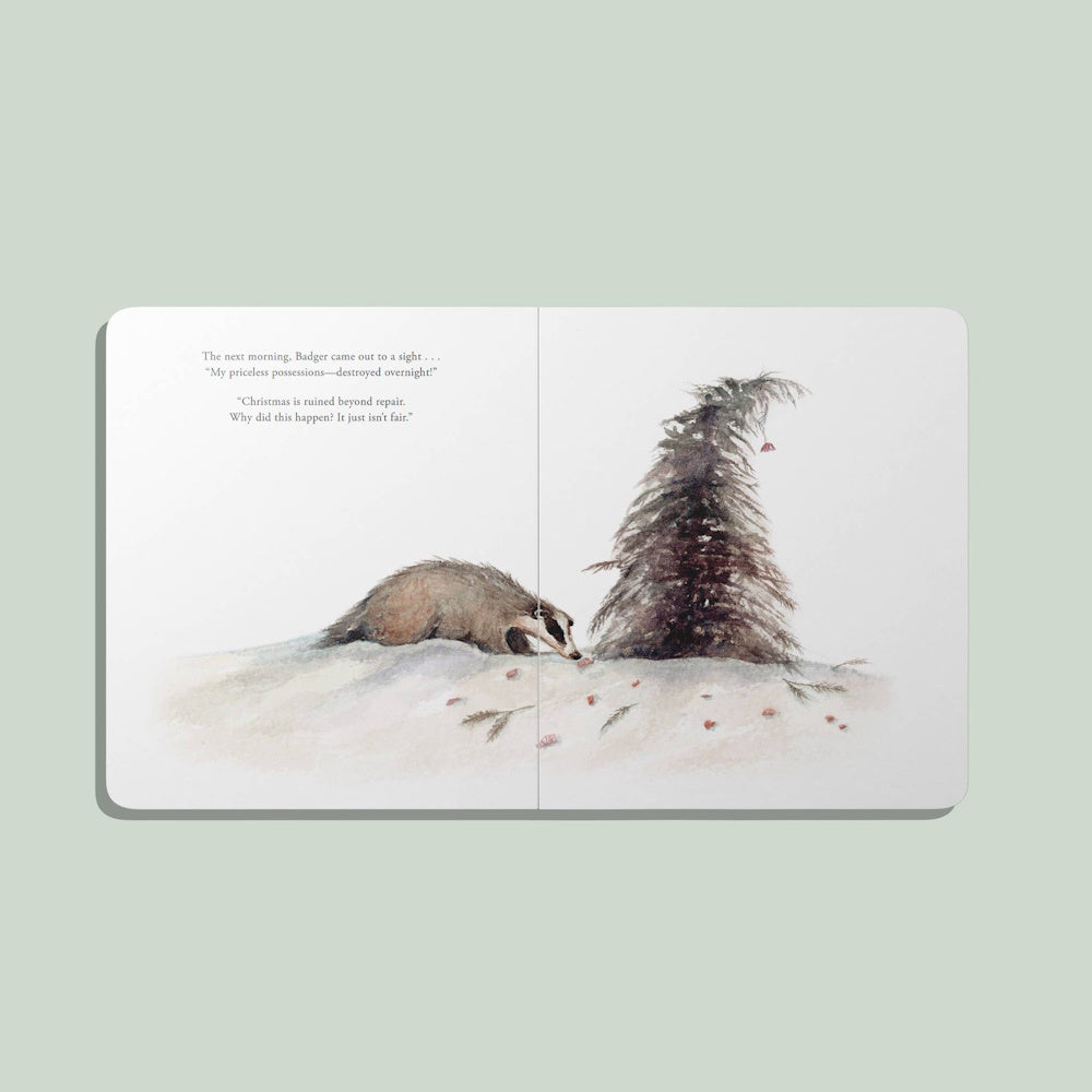 An illustration from a children's book showing a badger looking at a damaged Christmas tree in a snowy scene.