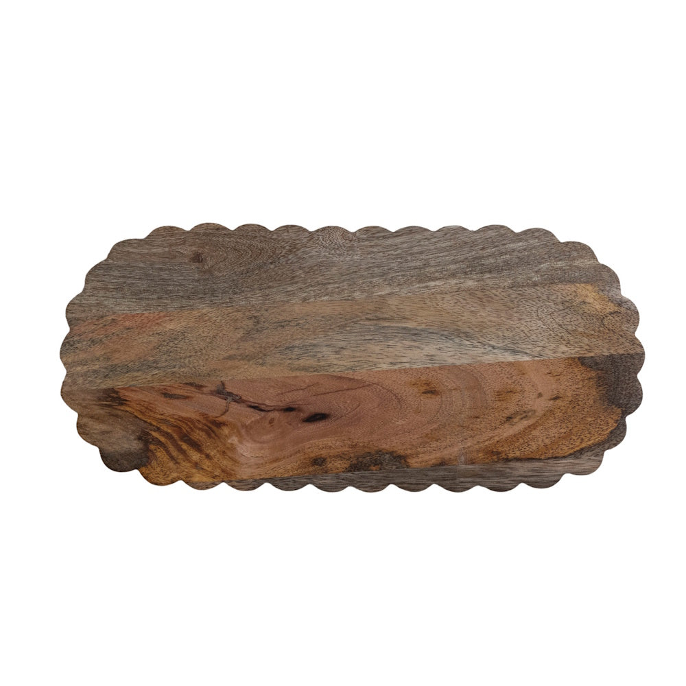 Oval wood serving board with a scalloped edge and prominent natural grain patterns on a white background.