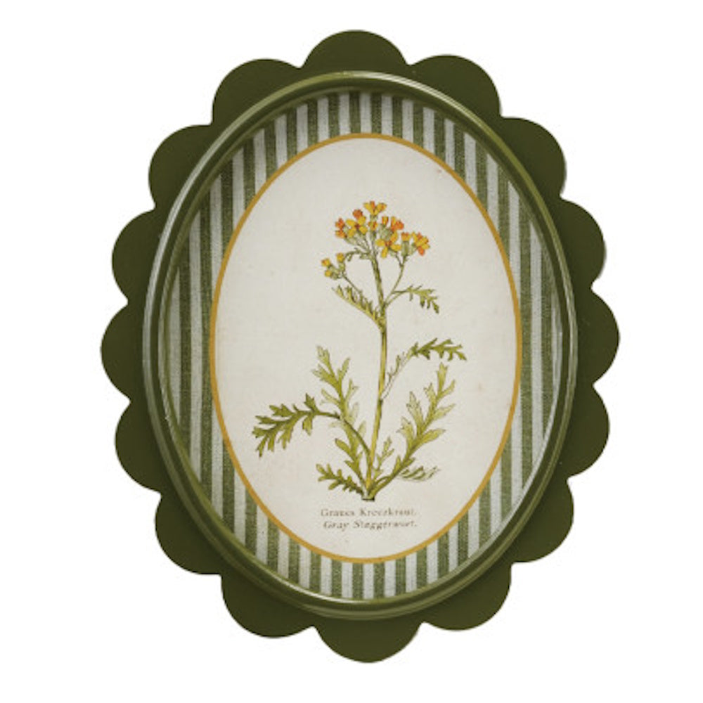 Oval green scalloped wall decor featuring a botanical flower illustration over a green and white striped mat.