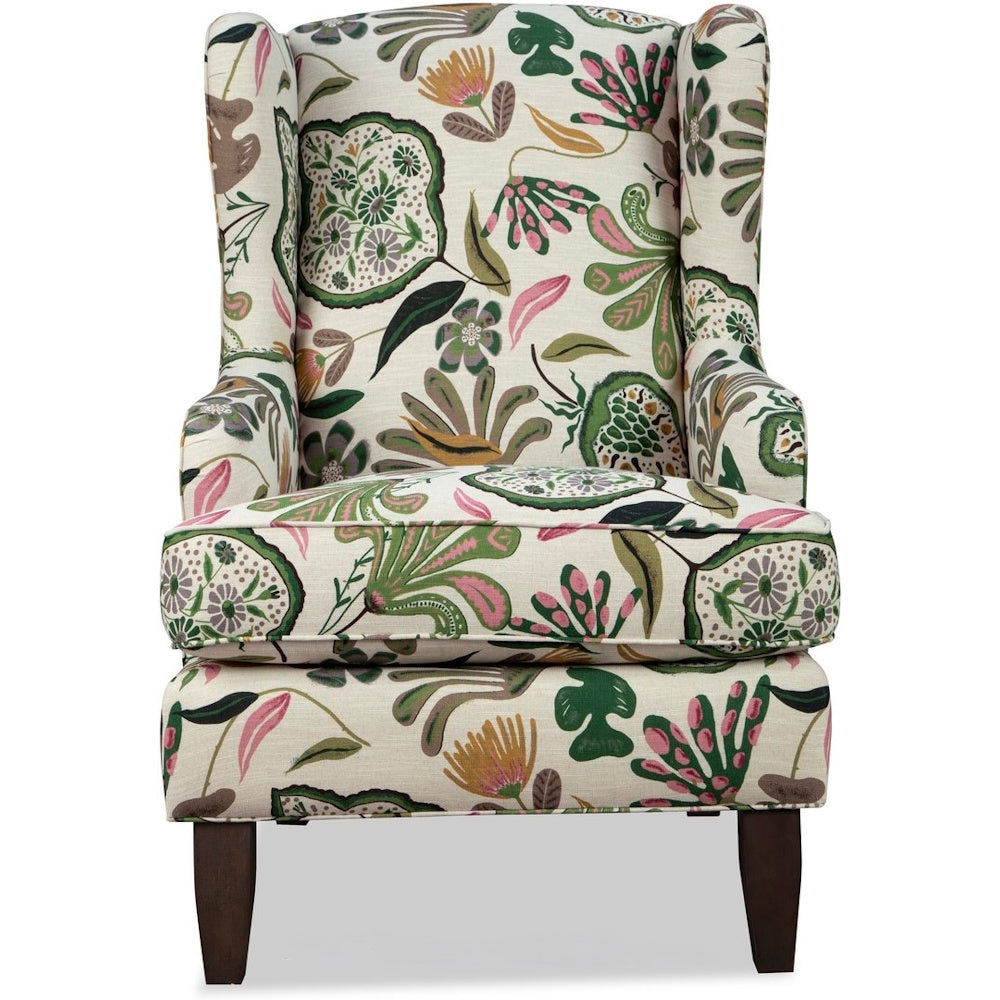Front view of a high-back wingchair with colorful botanical upholstery and dark brown legs.