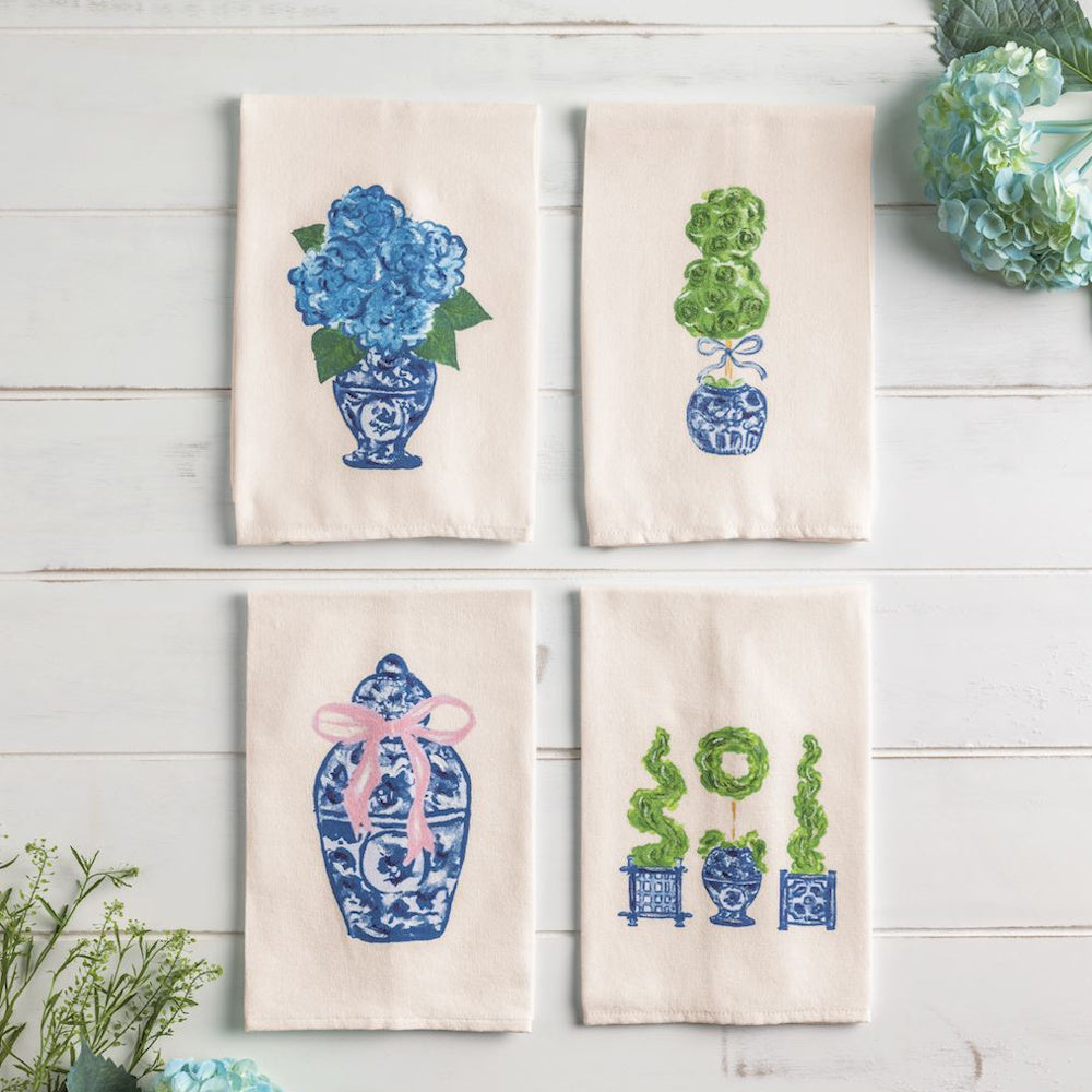 Set of four white tea towels featuring blue Chinoiserie vases with painted topiaries and hydrangeas.