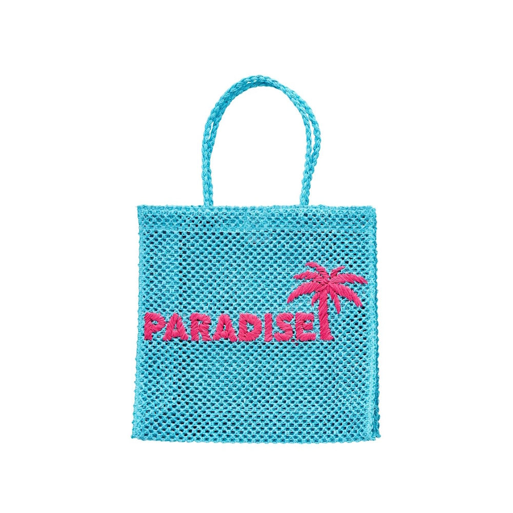 Bright blue woven tote bag with two top handles, featuring the word "PARADISE" and a palm tree embroidered in pink.