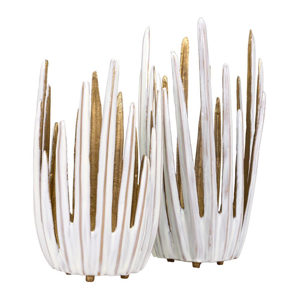 Modern white and gold abstract ceramic candle holders with textured, pointed spikes and a metallic gold interior.