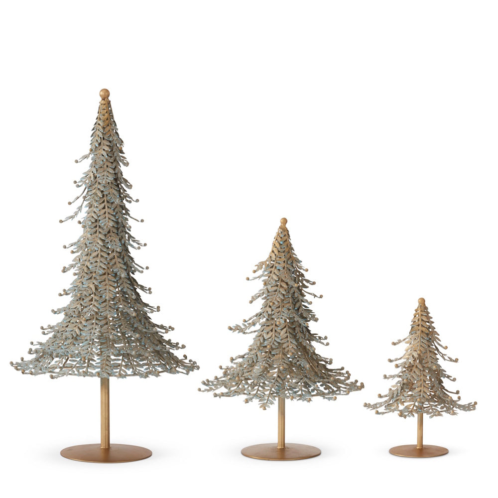 Front view of three patina green and gold metal Christmas tree figurines.