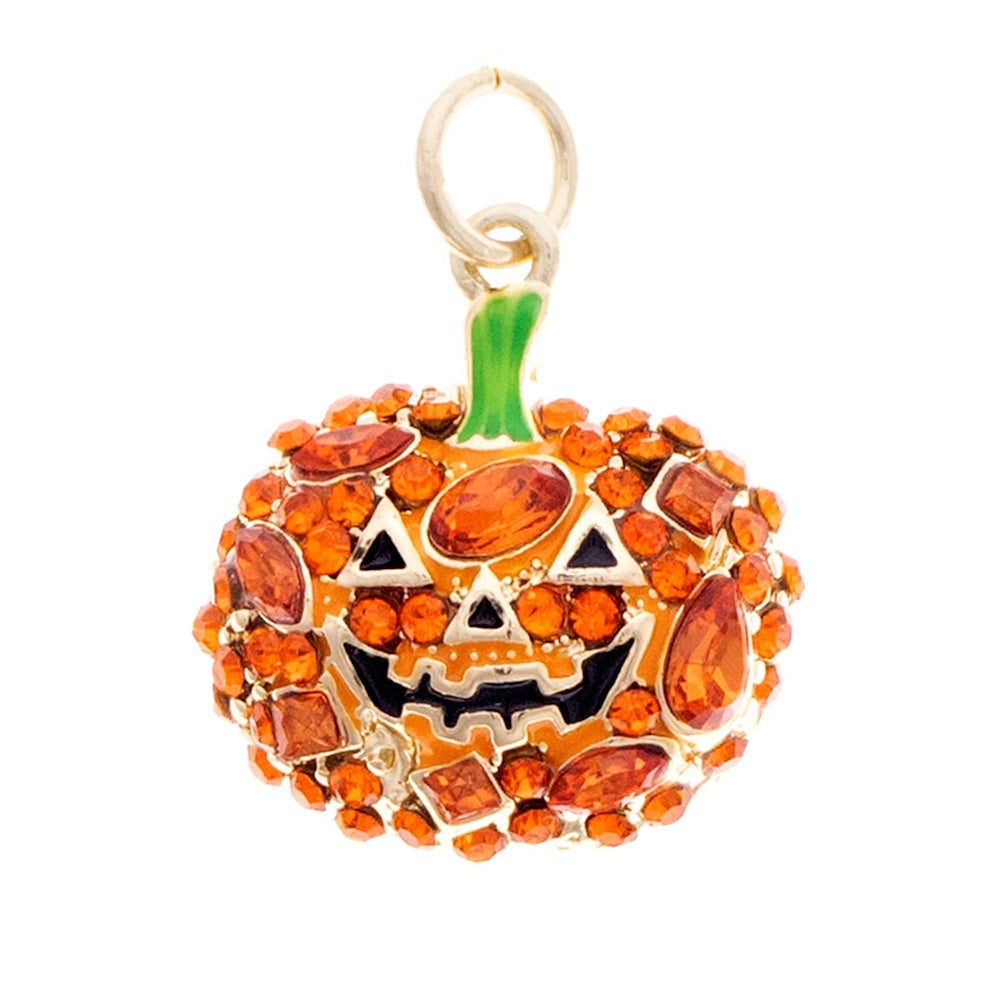 Orange crystal-encrusted jack-o'-lantern jewelry charm with a green stem and a smiling face.