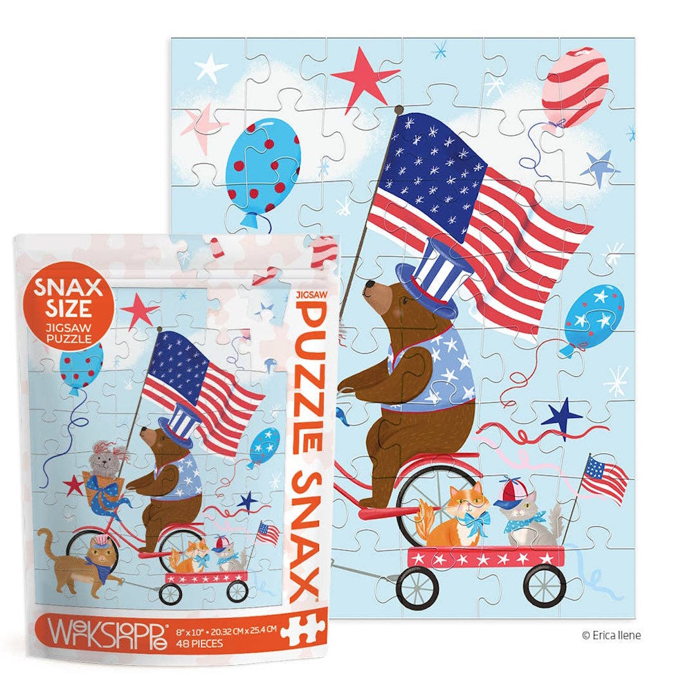 Illustration of a bear riding a bike with a wagon of cats and an American flag, featuring the jigsaw puzzle packaging.