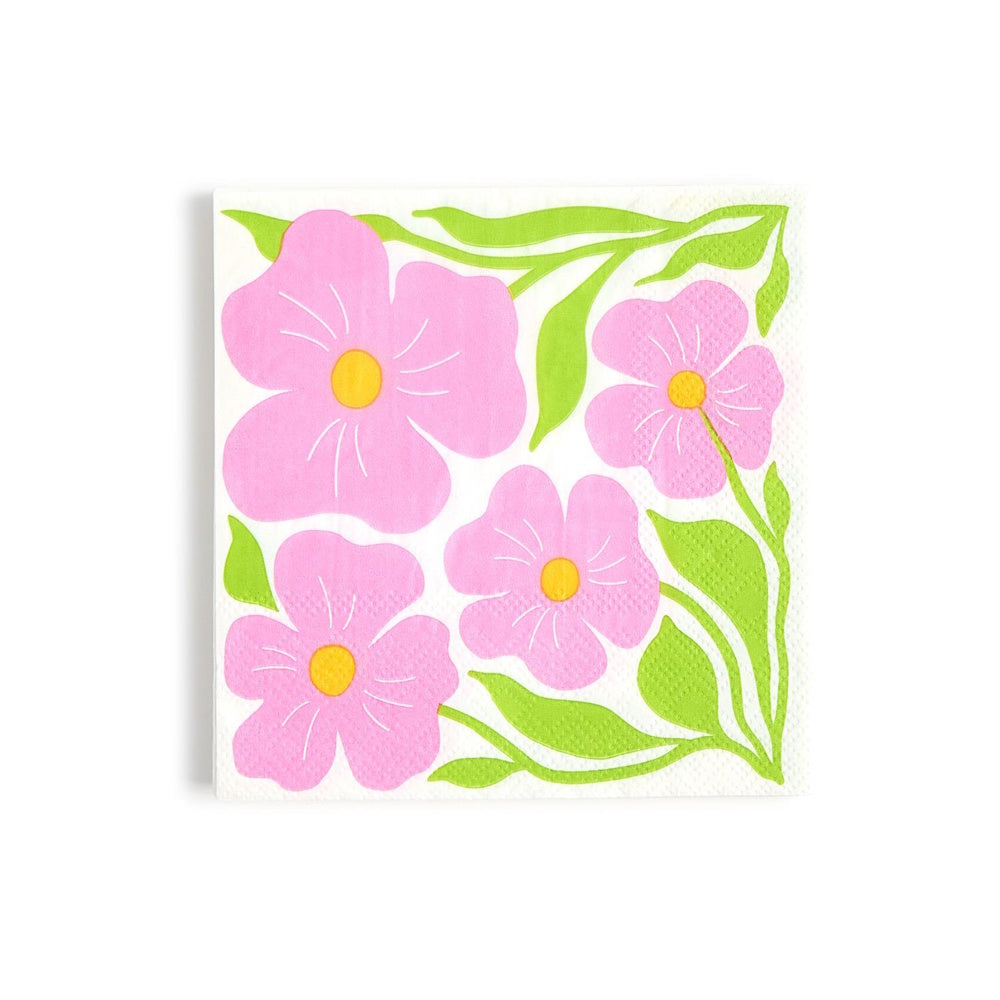 Square paper cocktail napkin featuring a vibrant pink floral pattern with yellow centers and green leaves.