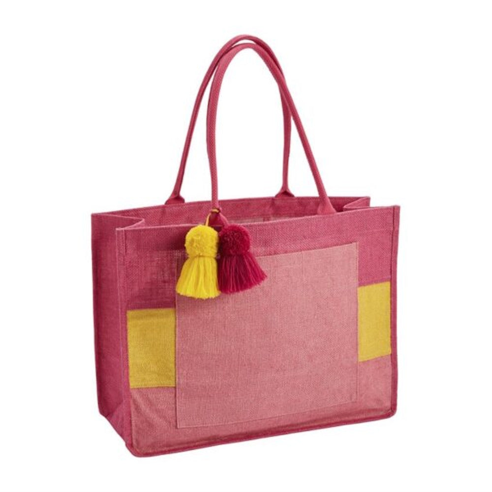 Pink woven tote bag with a front pocket, yellow accents, and hanging yellow and pink tassels.