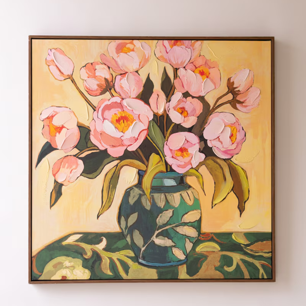 Square framed painting of pink peonies in a patterned teal vase against a warm yellow background.