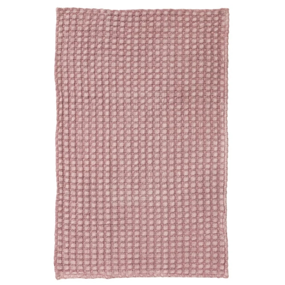 Dusty rose oversized stonewashed cotton waffle weave tea towel with a textured grid pattern on a white background.