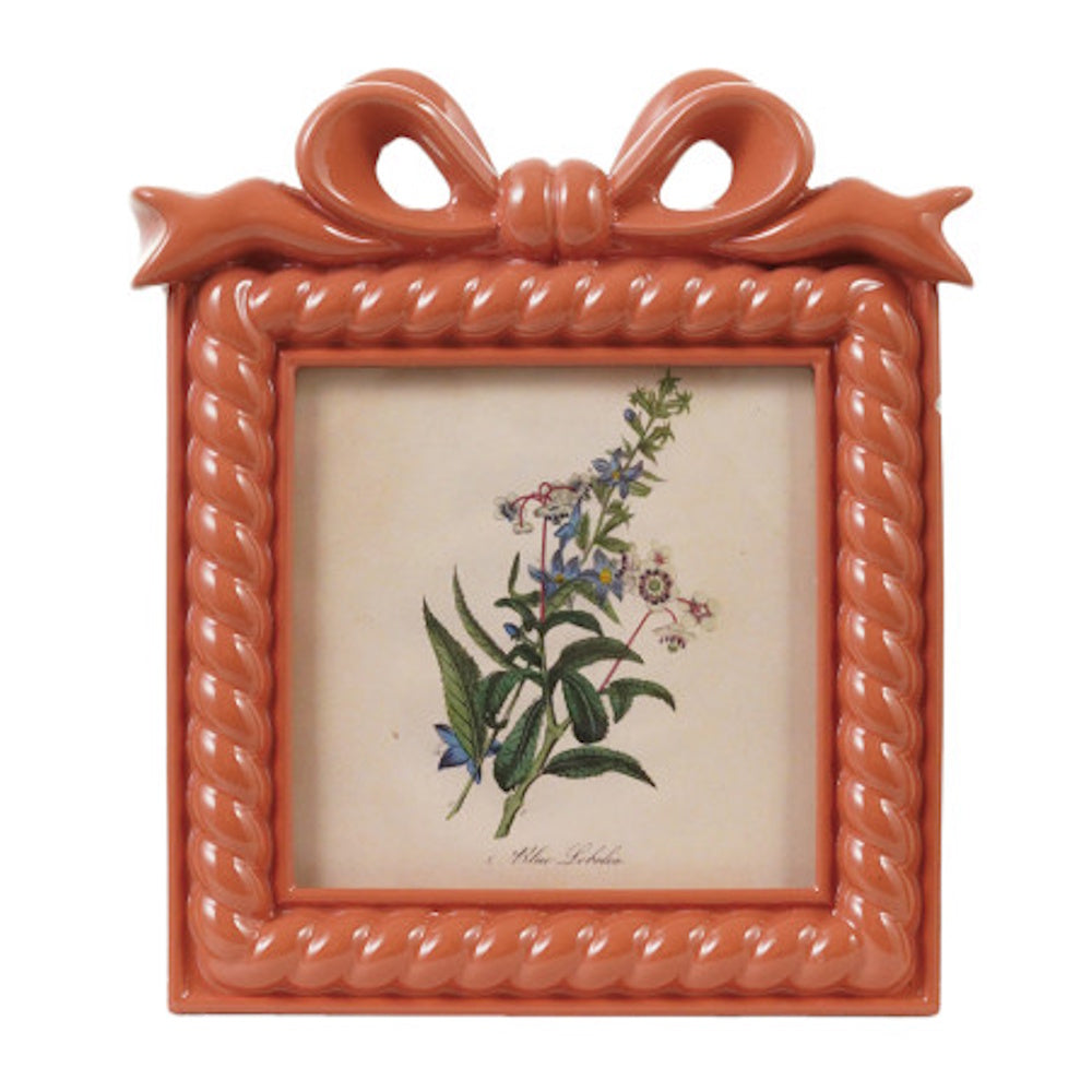 Pink resin photo frame with a rope-textured border and a decorative bow on top.