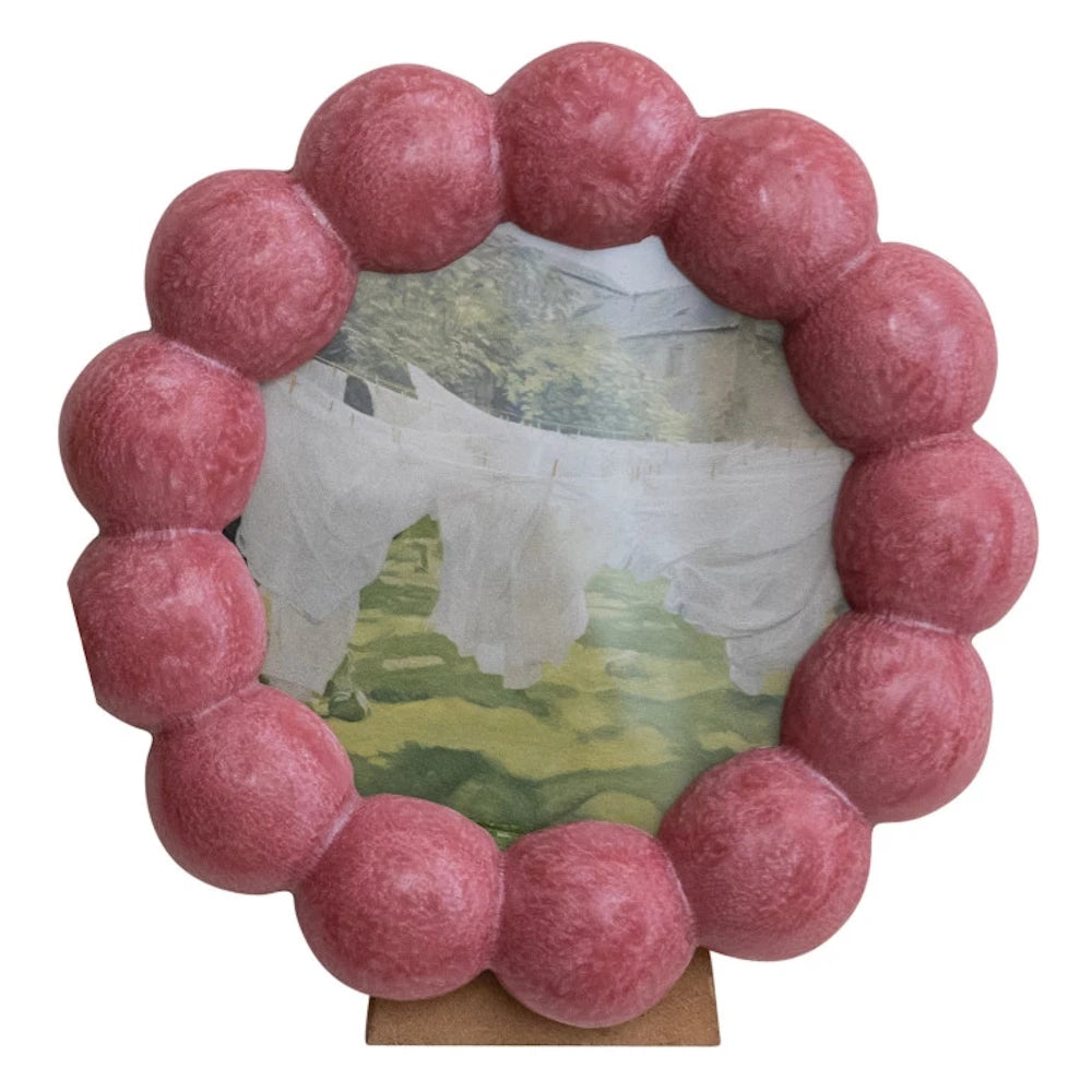 Pink round scalloped resin photo frame with bubble texture, featuring a landscape photo on an MDF wood stand.