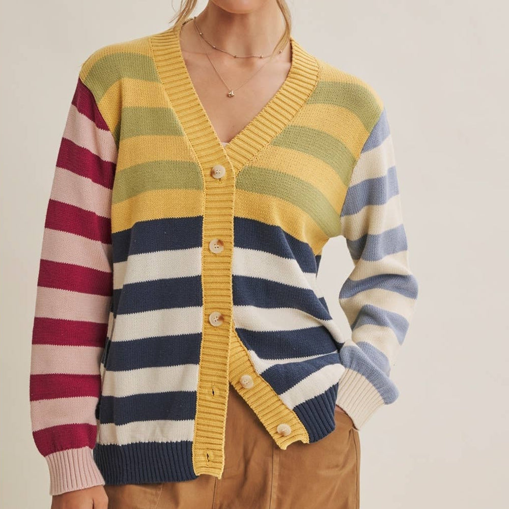 Colorblock striped button-down cardigan with a yellow ribbed trim and mismatched multicolor sleeves.