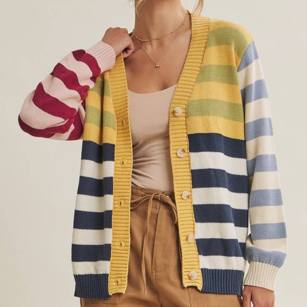 Open button-down cardigan in a colorful mix of striped patterns with mustard yellow ribbed trim.