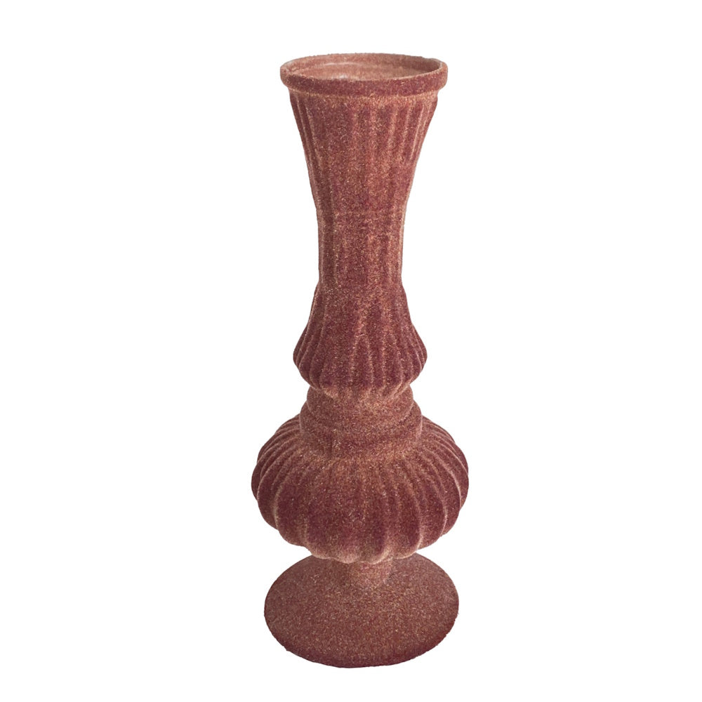 Plum-colored embossed velvet-textured footed glass vase with ribbed details against a white background.