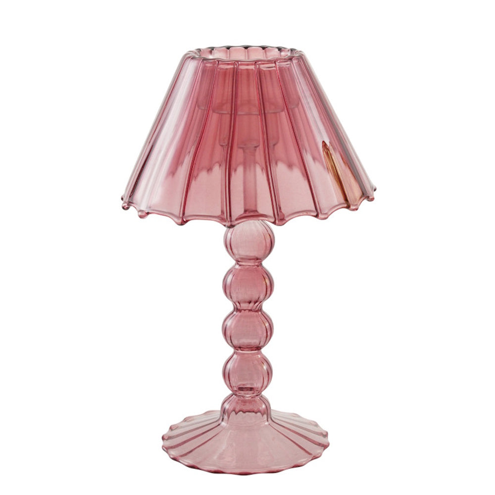 Pinkish-purple lampshade-style glass candle holder with a beaded stem and scalloped base.