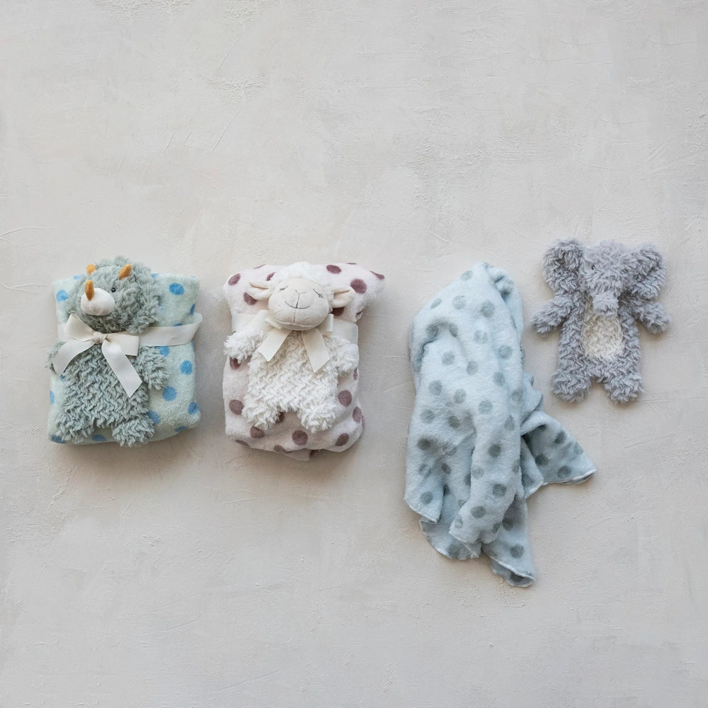 Plush animal toy and polka dot baby blanket sets including a rhino, lamb, and elephant in soft pastel colors.