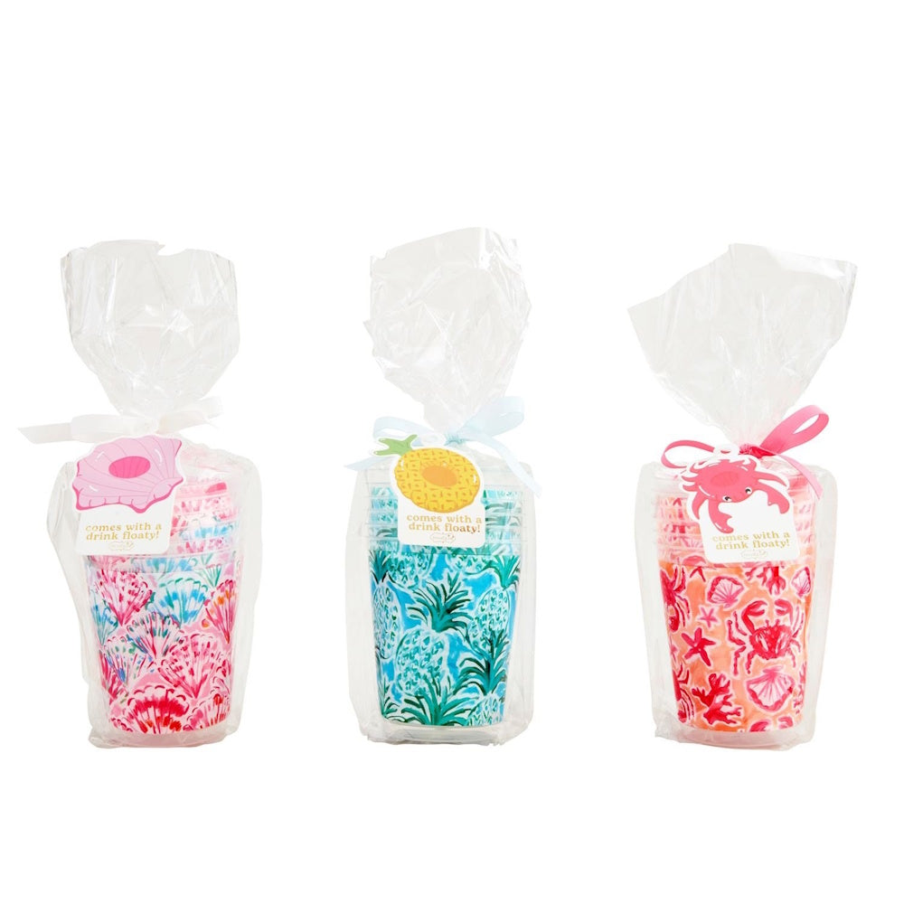 Three sets of colorful, patterned party cups wrapped in cellophane with ribbons and themed gift tags.