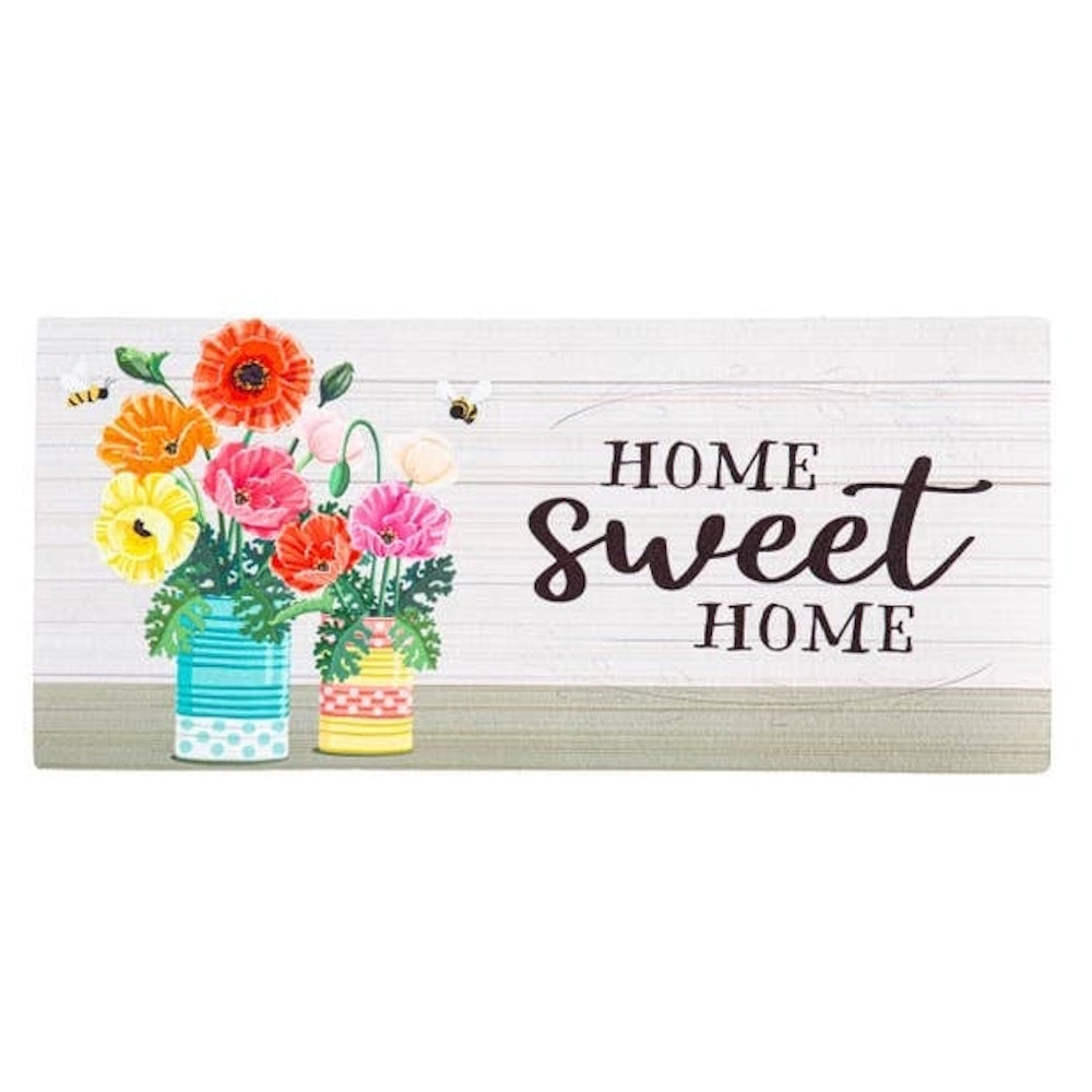 A doormat reading "Home Sweet Home" next to colorful poppies in painted tin cans with little bees.