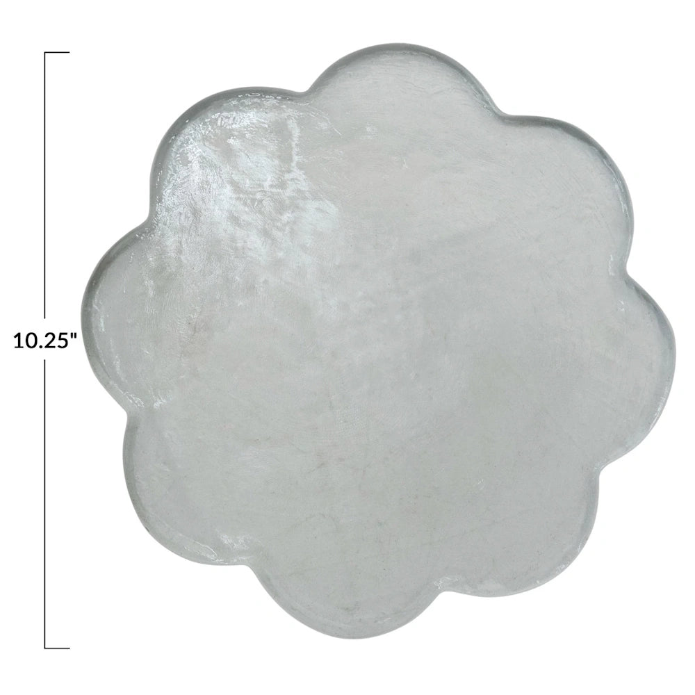 Top-down view of a 10.25-inch scalloped clear pressed glass cheese serving board with a textured finish.