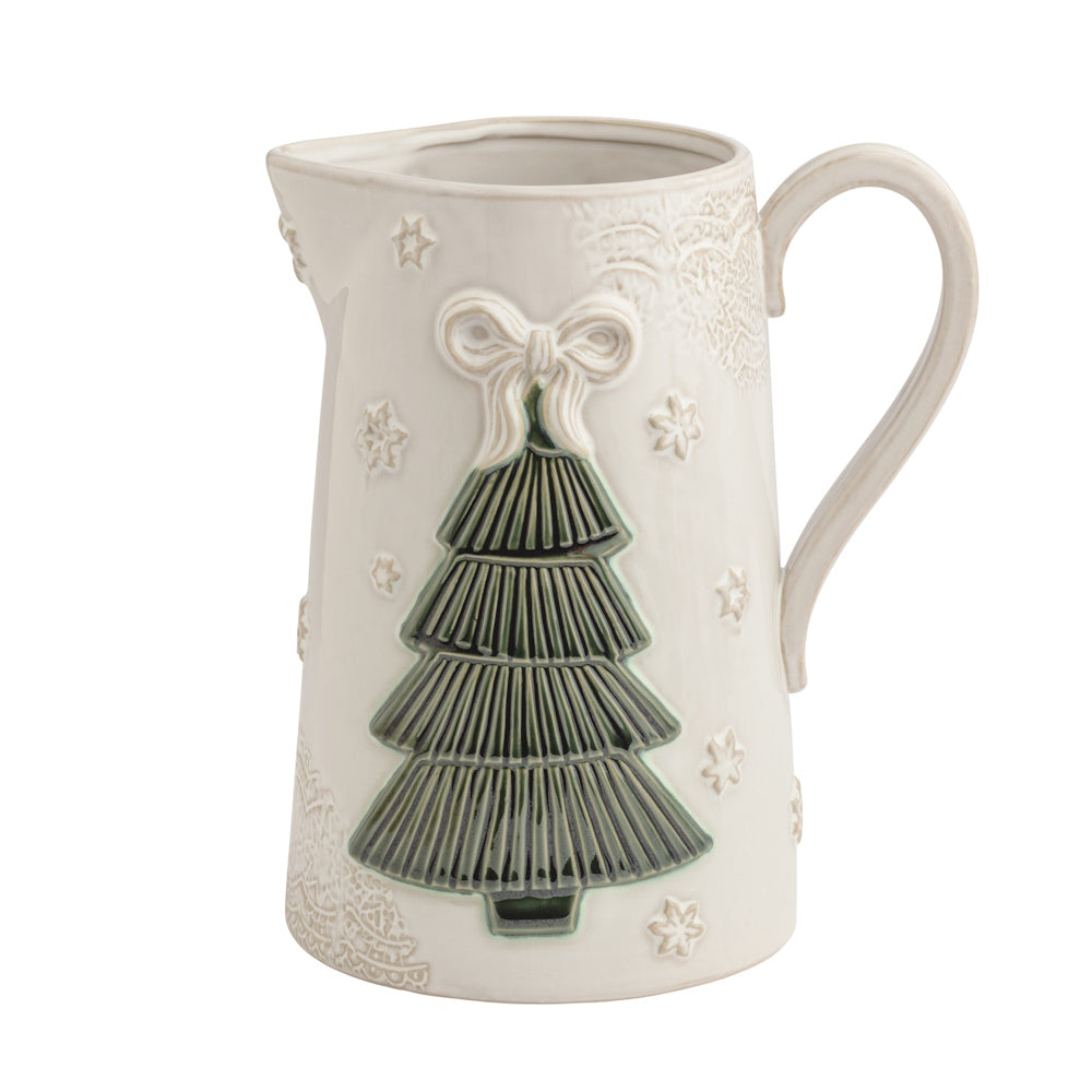 Front view of a cream ceramic Christmas tree pitcher featuring a green textured tree and lace embossing.
