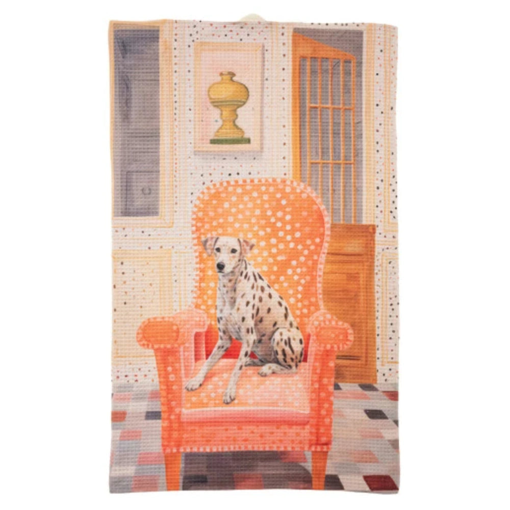 Dalmatian dog sitting on an orange polka-dot armchair on a waffle-texture tea towel with an artistic room background.