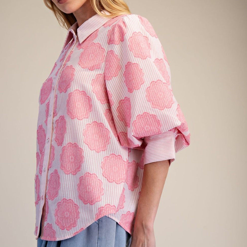 Pink and white striped button-down shirt featuring textured pink floral patterns and voluminous puff sleeves.