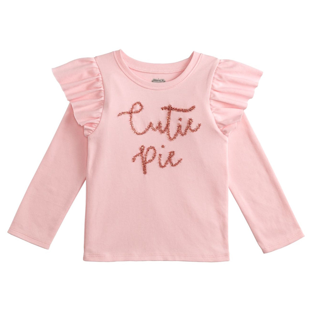 A pink, long-sleeve toddler shirt featuring ruffled shoulders and the text "Cutie Pie" in pink tinsel.