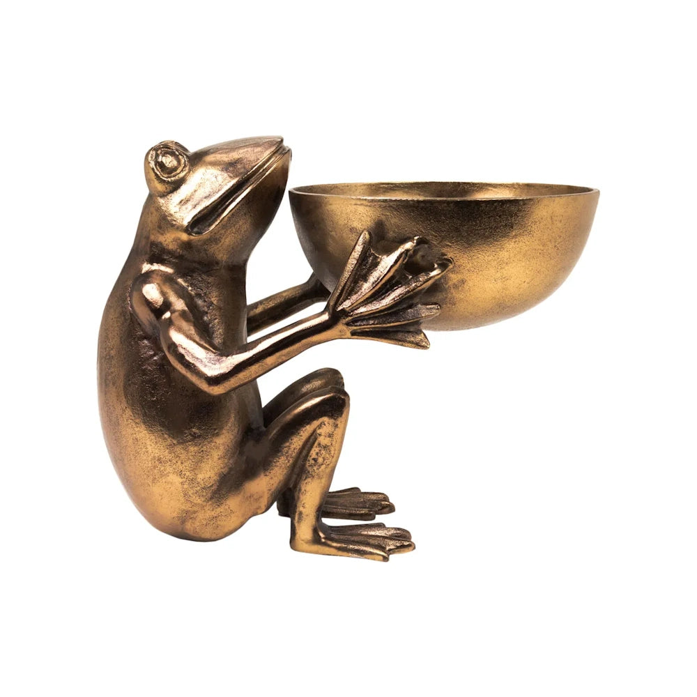 Antique brass frog figurine sitting and holding a small round bowl with its front feet.
