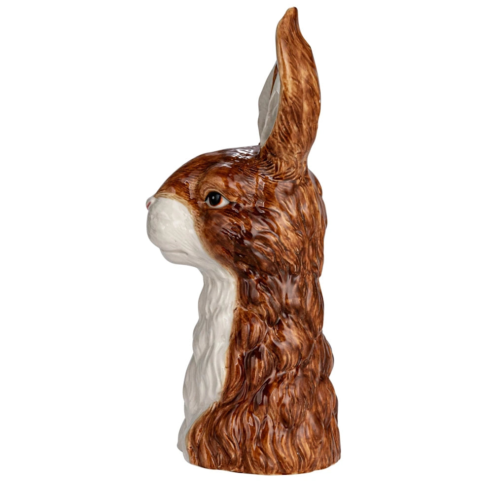 Profile view of a hand-painted stoneware hare vase with brown and white glazed ceramic fur.