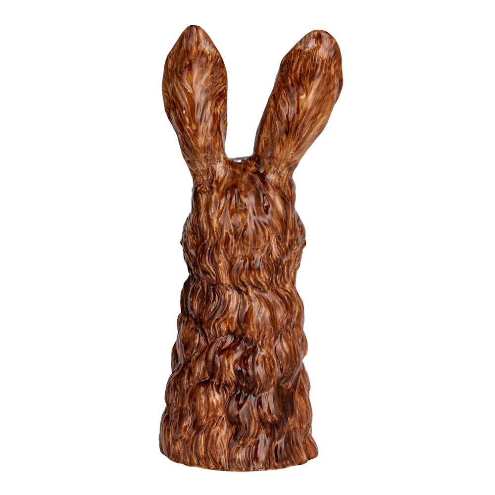 Back view of a hand-painted brown stoneware rabbit vase on a white background.
