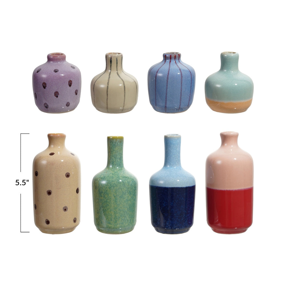 Eight small, assorted ceramic vases in two rows with different glazes and a 5.5" height indicator.