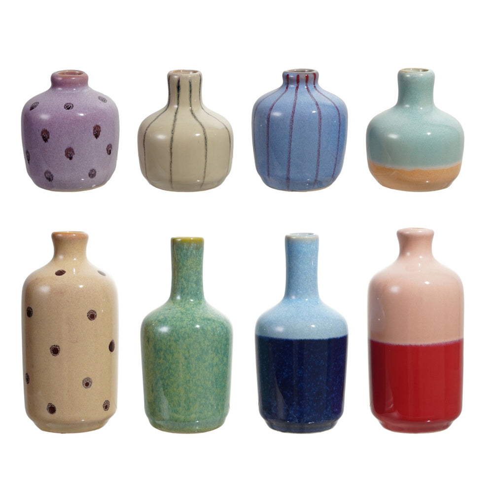An assortment of eight mini reactive-glaze stoneware vases in two rows on a white background.