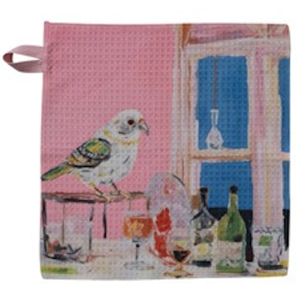 Pink waffle-weave dish cloth featuring a painted bird perched near a table with wine bottles and glasses.