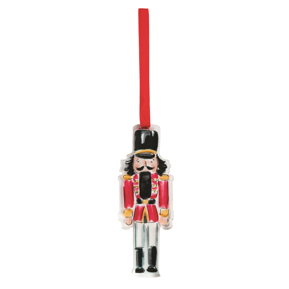 Red acrylic nutcracker ornament with a hanging ribbon.
