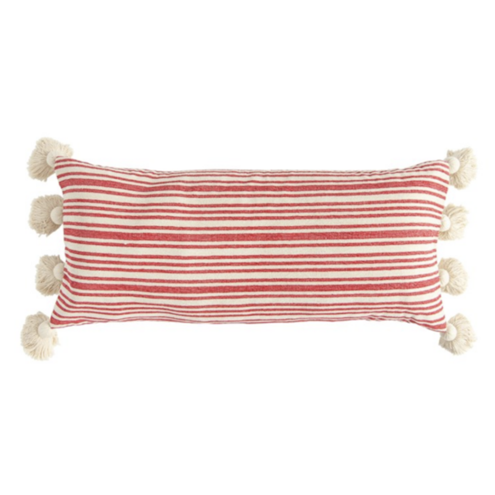 A rectangular lumbar pillow with thin horizontal red and cream stripes and large cream tassels on the short sides.