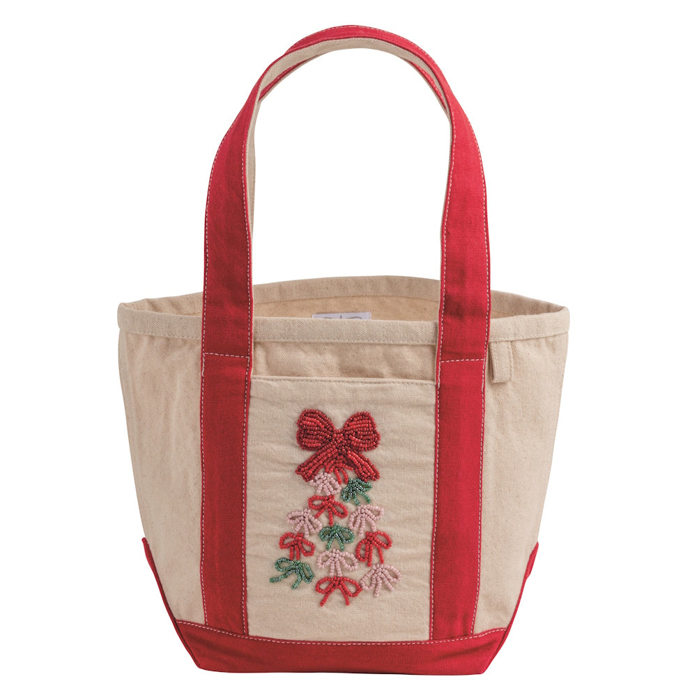 Beige canvas mini tote bag featuring red handles and a beaded Christmas bow tree design.