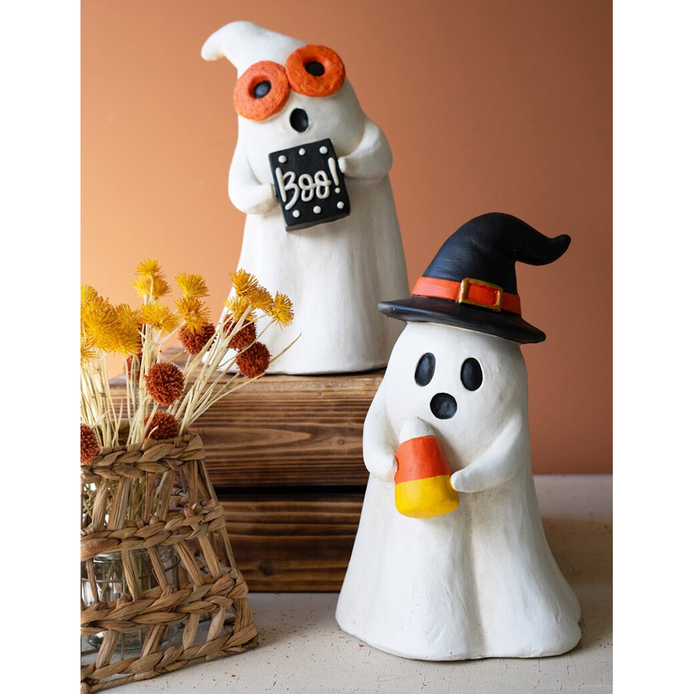 Two resin Halloween ghost figurines, one with a witch hat and another holding a "Boo!" sign.