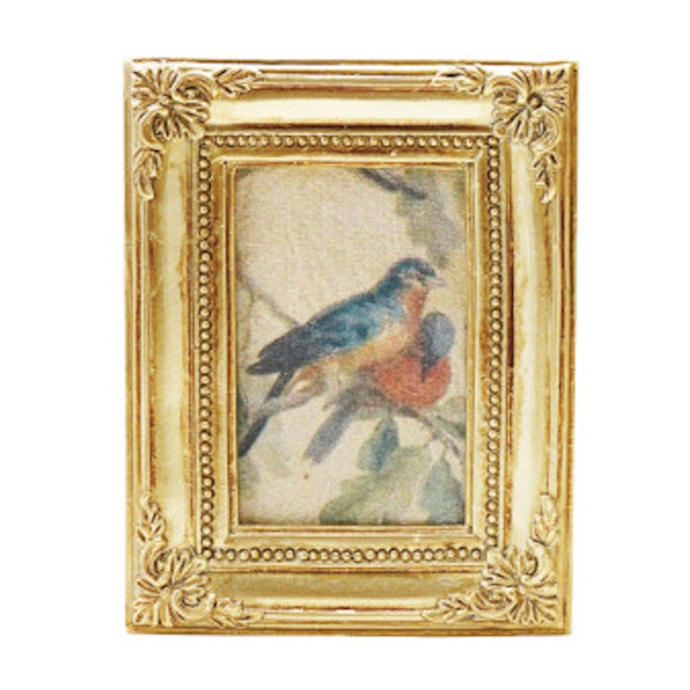 Miniature gold ornate frame featuring a vintage-style illustration of two blue and orange birds perched on a branch.