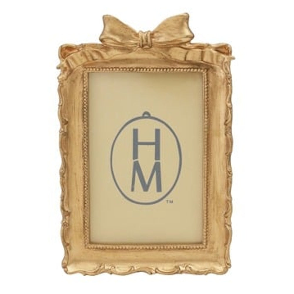 Ornate gold picture frame with a decorative bow on top, vintage style rectangular photo frame for home decor.