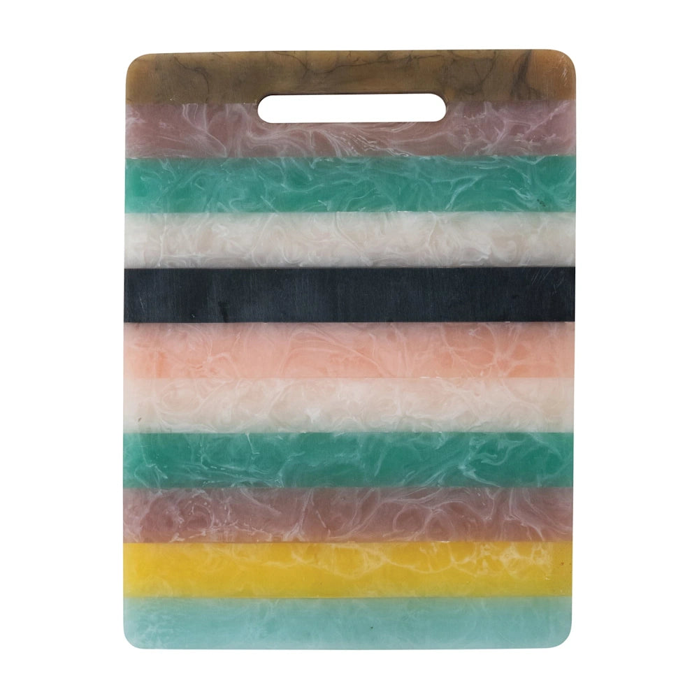 Colorful striped resin cutting board with marbled texture and cutout handle.
