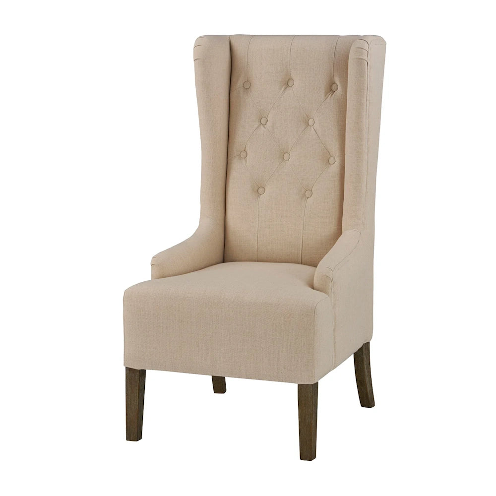 Beige tufted wingback accent chair with high back and dark wood legs on a white background.