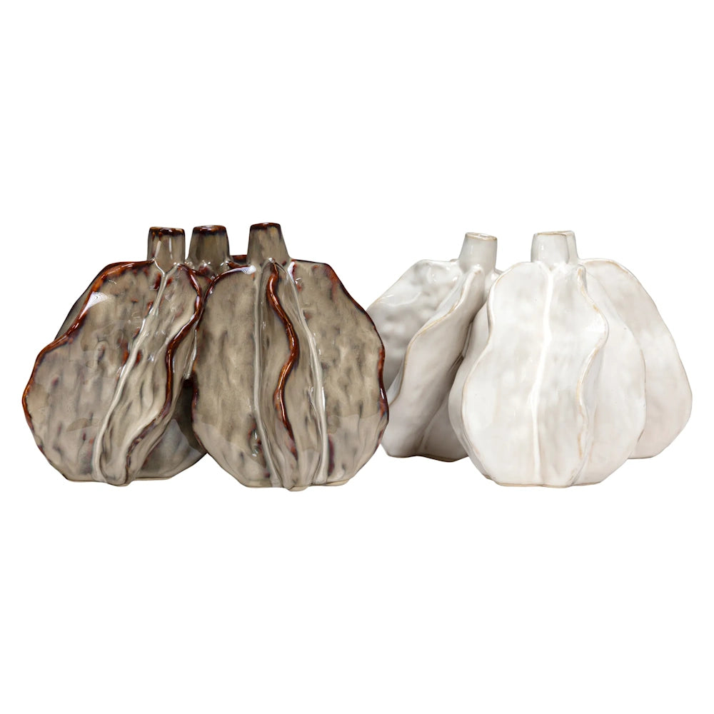 Two sets of organic, wavy ceramic bud vases, one set in glossy taupe with brown edges and one set in white.