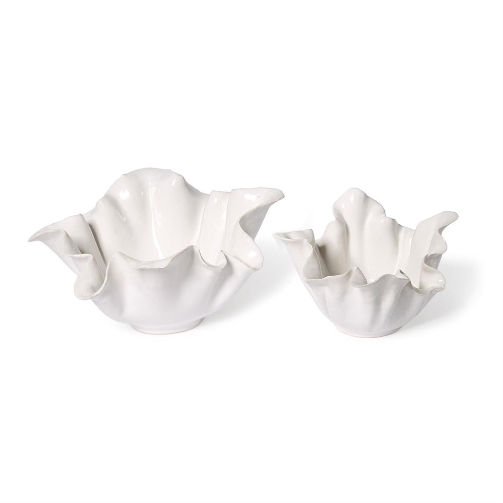 Two glossy white ceramic bowls with organic, wavy ruffled rims in large and small sizes on a white background.