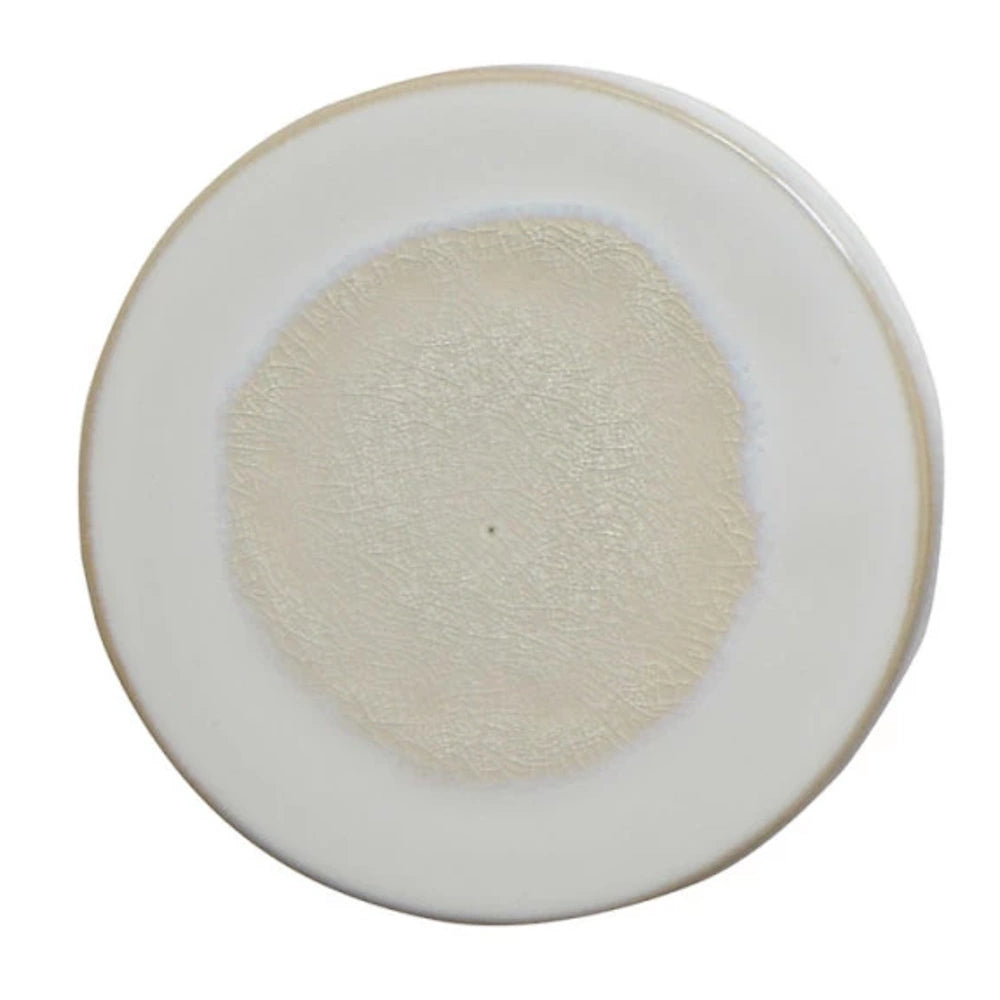 Round cream stoneware trivet with a reactive glaze finish and natural beige textured center for kitchen heat protection.