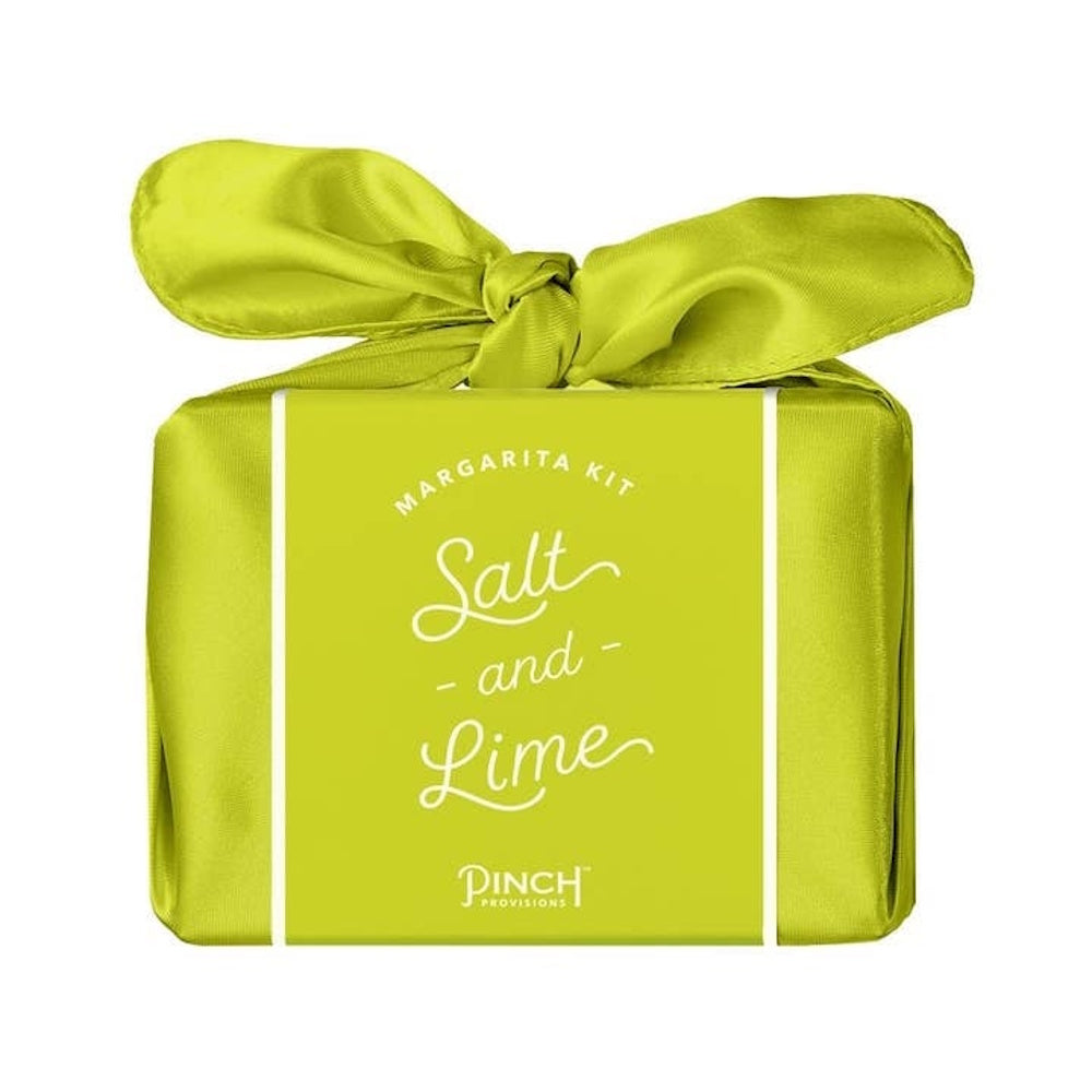 Lime green Margarita Kit box wrapped in a satin bow, labeled "Salt and Lime" by Pinch Provisions.
