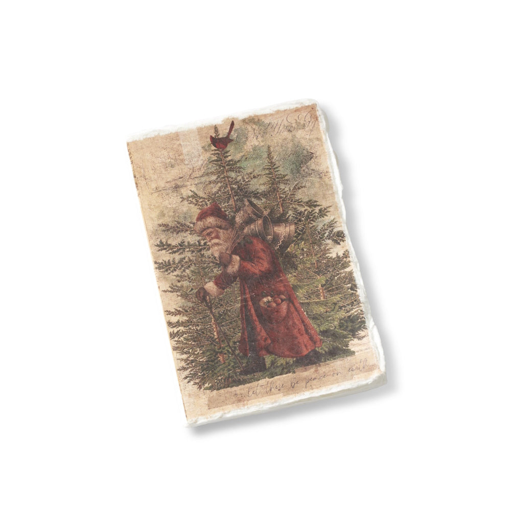 A soft-cover Christmas journal featuring a vintage illustration of Santa carrying bells and a deckle edge.