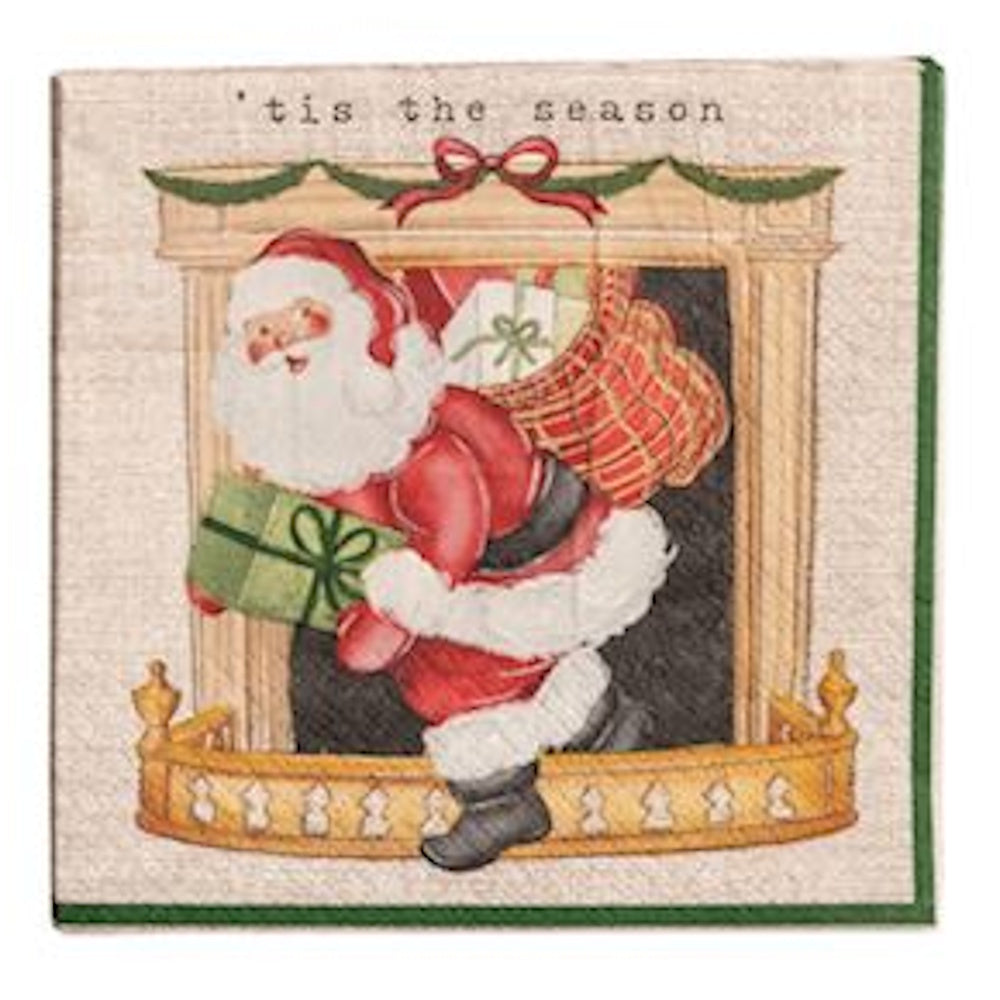 Square cocktail napkin featuring Santa Claus stepping out of a fireplace carrying a green gift box, with the text "'tis the season."