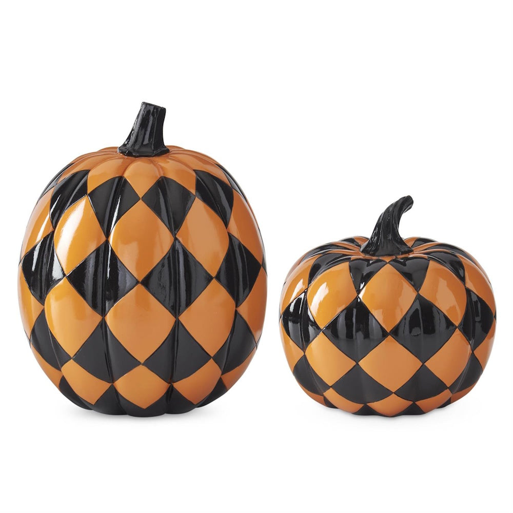 Two glossy decorative pumpkins featuring a black and orange diamond harlequin pattern.